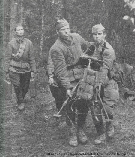 [The crew of an M1938 82-mm mortar displace forward to a new firing position.]